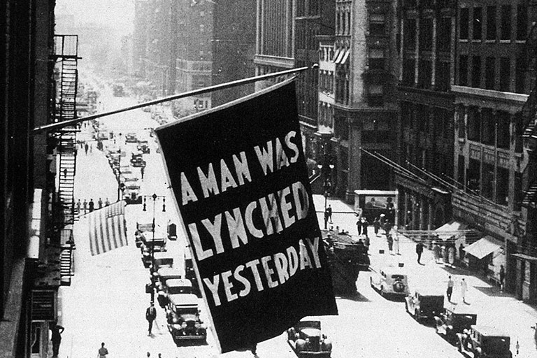 An NAACP flag on 5th Ave. in New York City that states 'A man was lynched yesterday'